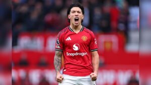 Lisandro Martinez celebrating passionately in a red Manchester United jersey at Old Trafford