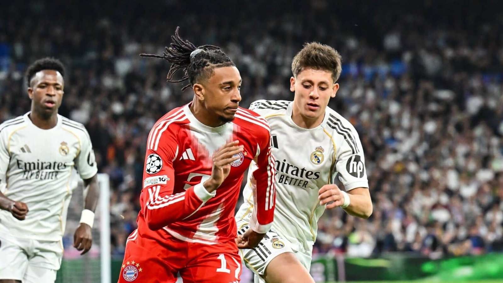 Footballer Michael Olise playing in a match alongside other players on the pitch