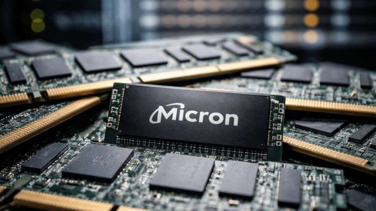 Close-up view of a Micron memory module resting on computer circuit boards with server racks in the