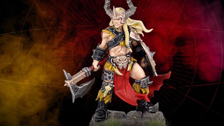 Painted Warhammer miniature of the Darkoath Warqueen with horned helmet, axe, and shield standing on