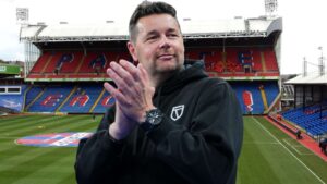 Crystal Palace manager Pierre Sage applauding on the pitch at Selhurst Park stadium