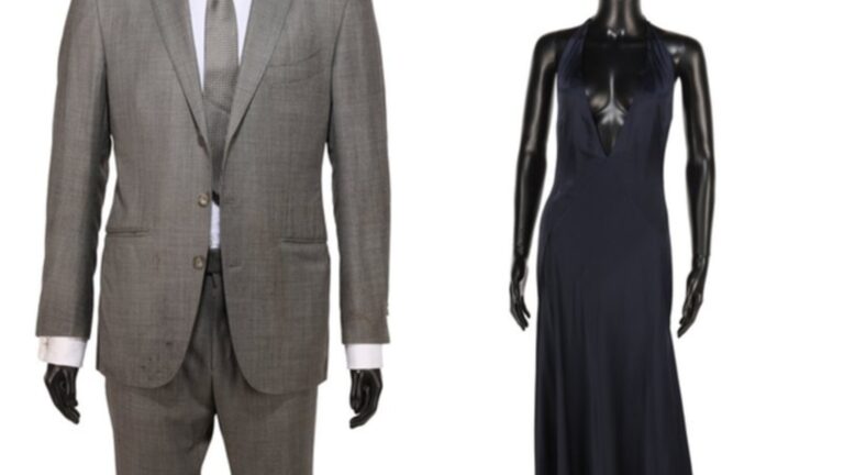 Mannequins displaying a grey Tom Ford suit and a black dress from James Bond films