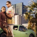 Lucia and Jason posing in front of a green sports car with palm trees and a city skyline