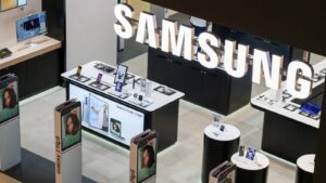 High angle view of a modern Samsung retail store interior featuring lighted brand signage and produc