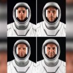 Four astronauts wearing white SpaceX spacesuits and helmets against a dark background