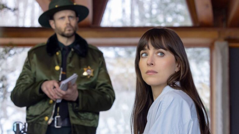 Dakota Johnson and a police officer in a scene from the film Verity