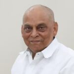 Portrait of JD-U leader Vijay Kumar Choudhary wearing a white shirt