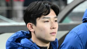 Close-up portrait of Westerlo forward Yang Min-hyeok wearing a blue jacket